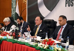 Finance Minister Muhammad Aurangzeb, along with Information Minister Attaullah Tarar and Minister of State for Finance Bilal Azhar Kayani, addresses a post-budget press briefing on the Federal Budget 2026–27 at P-Block, Pakistan Secretariat