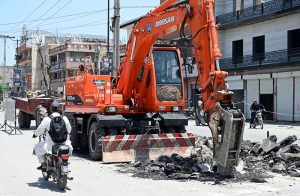 Deep Excavation Underway as workers install large water supply pipelines using heavey machinery on Saidpur Road.