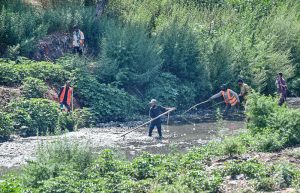 CDA workers clean a drainage channel along the Islamabad Expressway as part of ongoing efforts to improve sanitation and ensure smooth water flow for the monsoon season in the federal capital.