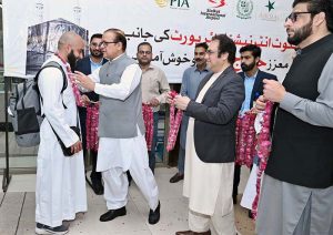 Minister of State for Development and Planning Chaudhry Armaghan Subhani, Chairman Sial Hassan Ali Bhatti welcomes the first and second flight pilgrims returning from Saudi Arabia at the Sialkot International Airport