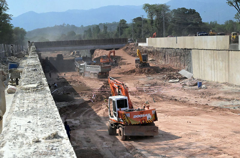 Heavy machinery is engaged in construction work at the Park Road underpass project in the Federal capital
