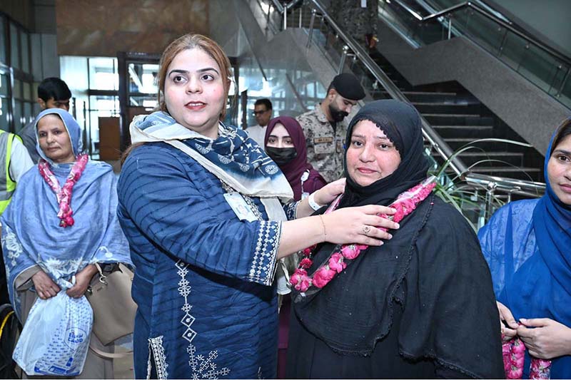 SIAL staff are welcoming female pilgrims from the first and second Hajj flights returning from Saudi Arabia at Sialkot International Airport
