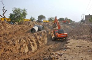 Heavy machinery is being used during the sewerage line work on Naw Bihar Road under the Infrastructure Development Project to expand the city's drainage network.