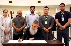 Imran Salahuddin, Chairman of the Pakistan Readymade Garments Manufacturers and Exporters Association (PRGMEA), signs the visitor's book at the PIFD Thesis Display 2026 held at the Pakistan Institute of Fashion and Design (PIFD), The annual thesis display showcases the creative talent and innovative designs of graduating students of Pakistan's premier fashion and design institution.