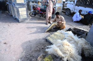 A skilled worker making room air coolers at his local workshop in the City.