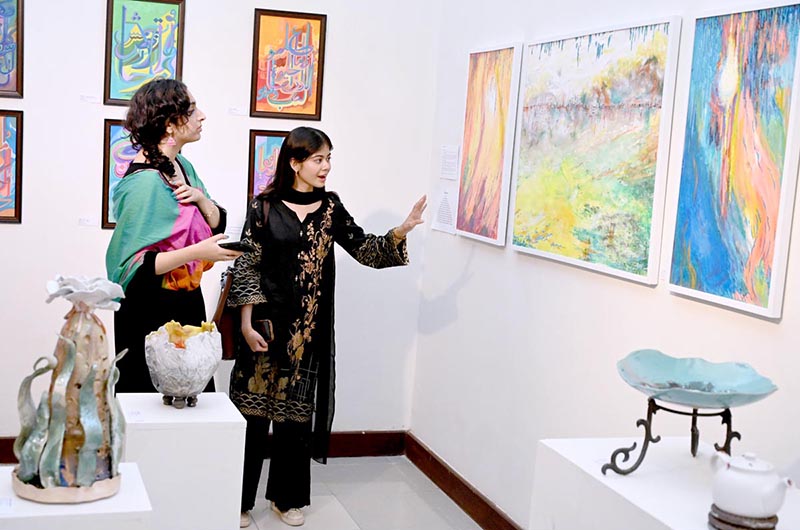 The art lovers showing interest in artwork on display during the inaugural ceremony of Offgrid studio's "Rejected" art Exhibition at PNCA