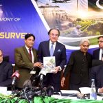 Finance Minister Muhammad Aurangzeb showing the copy of Pakistan Economic Survey 2025-2026 during launching ceremony