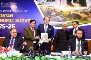 Finance Minister Muhammad Aurangzeb showing the copy of Pakistan Economic Survey 2025-2026 during launching ceremony