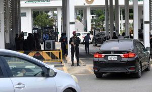 Security personnel are on alert outside the Parliament House amid tight security arrangements during the presentation of the Federal Budget 2026-27 in the National Assembly