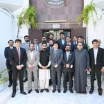 Consul General H.E. Hussain Muhammad, accompanied by Rashid-ul-Islam, Asad Malik, Muhammad Shabbir Merchant, Saleem Akhtar, Khalid Hussain Chaudhry, Majid Rafiq, Mohammad Shoaib and officers of the Consulate General of Pakistan, Dubai, poses with distinguished guests during the International Day of Family Remittances ceremony organized in collaboration with NBP UAE