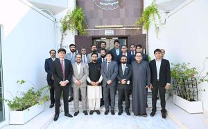 Consul General H.E. Hussain Muhammad, accompanied by Rashid-ul-Islam, Asad Malik, Muhammad Shabbir Merchant, Saleem Akhtar, Khalid Hussain Chaudhry, Majid Rafiq, Mohammad Shoaib and officers of the Consulate General of Pakistan, Dubai, poses with distinguished guests during the International Day of Family Remittances ceremony organized in collaboration with NBP UAE