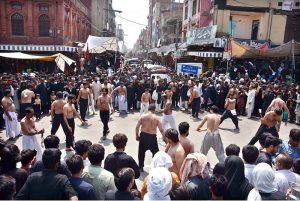 Mourners oozing themselves with knives and chains during procession on 10th of Holy Month of Muharramul Harram. Muharram is the mourning month in remembrance of the Shahadat of Hazrat Imam Hussain (RA), the Grandson of the Holy Prophet Mohammad (PBUH)
