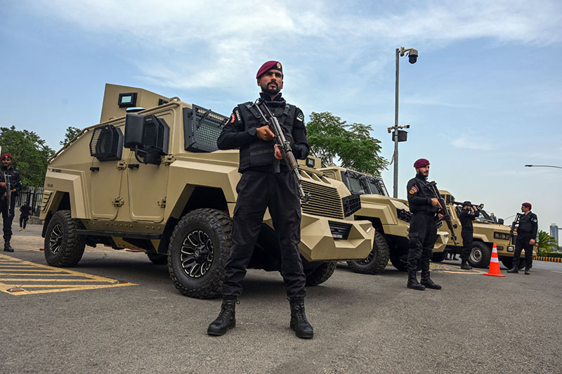 Security personnel stand alert at Parliament House to maintain law and order during the Federal Budget 2026–27 proceedings in the National Assembly in the federal capital