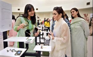 Film producer Ammara Hikmat interacts with graduating students during the PIFD Thesis Display 2026 in provincial capital.