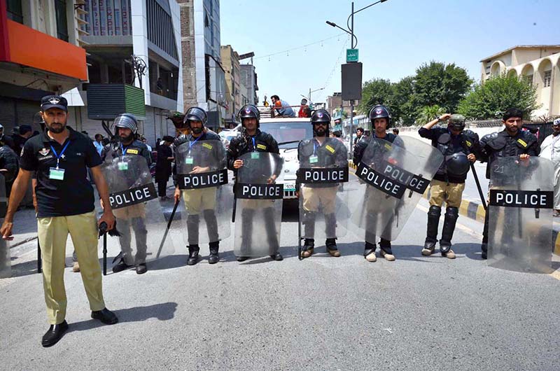 Police official standing high alert in front of Zuljinah procession on 9th Muharramul Haram at Sadar. Muharramul Harram known as the first month of the Islamic calendar and the mourning month in remembrance of the martyrdom (Shahadat) of Hazrat Imam Hussain (RA), the grandson of the Holy Prophet Mohammad (PBUH)