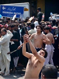 Mourners oozing themselves with knives and chains during procession on 10th of Holy Month of Muharramul Harram. Muharram is the mourning month in remembrance of the Shahadat of Hazrat Imam Hussain (RA), the Grandson of the Holy Prophet Mohammad (PBUH)