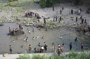 People swim at the Rawal Dam spillway in Chak Shahzad to beat the scorching heat as the mercury soars to around 46°C, with the ongoing heatwave driving residents to seek relief from the extreme temperatures in the federal capital.