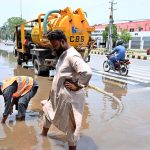 Cantonment Board employees drain accumulated rainwater from College Road to clear and restore smooth traffic flow and prevent public inconvenience following rainfall