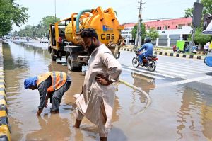 Cantonment Board employees drain accumulated rainwater from College Road to clear and restore smooth traffic flow and prevent public inconvenience following rainfall