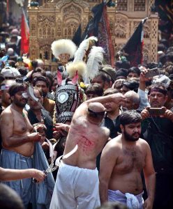 Mourners oozing themselves with knives and chains during procession on 10th of Holy Month of Muharramul Harram. Muharram is the mourning month in remembrance of the Shahadat of Hazrat Imam Hussain (RA), the Grandson of the Holy Prophet Mohammad (PBUH)