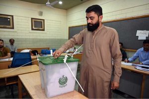 Election officials process ballot papers and verify voter credentials at a polling station during the Gilgit-Baltistan General Elections 2026.