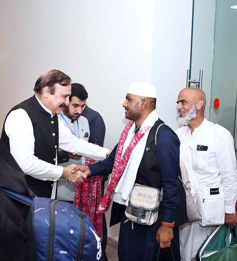 Federal Minister for Parliamentary Affairs Dr. Tariq Fazal Chaudhry welcomes Hajj pilgrims returning from Saudi Arabia at Islamabad Airport