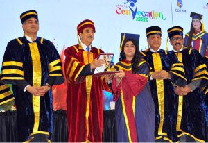 Chairman Senate of Pakistan Syed Yousaf Raza Gillani awards a distinction-holding graduate during the Annual Convocation 2026 of the College of Tourism and Hotel Management (COTHM) at a local hall.