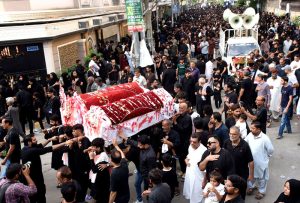 Mourners participate in the Soyem procession in remembrance of the martyrs of Karbala (Shuhada-e-Karbala), honoring the 72 loyal companions and family members of Hazrat Imam Hussain (AS) who sacrificed their lives on the Day of Ashura. The procession passes through various roads of the city