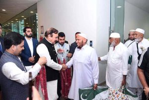 Federal Minister for Parliamentary Affairs Dr. Tariq Fazal Chaudhry welcomes Hajj pilgrims returning from Saudi Arabia at Islamabad Airport