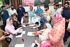 Federal Minister for Information and Broadcasting Attaullah Tarar's mother Sajida Farooq Tarar is listening to public affairs in his constituency NA-127