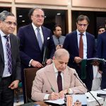 Prime Minister Muhammad Shehbaz Sharif signing Annual Budget 2026-27 documents after its approval by the Federal Cabinet meeting at Parliament House