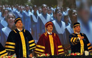 Chairman Senate of Pakistan Syed Yousaf Raza Gillani awards a distinction-holding graduate during the Annual Convocation 2026 of the College of Tourism and Hotel Management (COTHM) at a local hall.