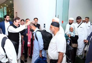 Federal Minister for Parliamentary Affairs Dr. Tariq Fazal Chaudhry welcomes Hajj pilgrims returning from Saudi Arabia at Islamabad Airport