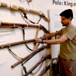 Visitor taking interest in display items at the Heritage Museum