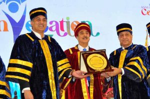 Chairman Senate of Pakistan Syed Yousaf Raza Gillani awards a distinction-holding graduate during the Annual Convocation 2026 of the College of Tourism and Hotel Management (COTHM) at a local hall.