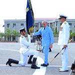 Prime Minister Muhammad Shehbaz Sharif handing over the flag to the high achieving company during the term at the passing out ceremony of 125th Midshipmen and 33rd SSC courses at Pakistan Naval Academy, PNS Rahbar