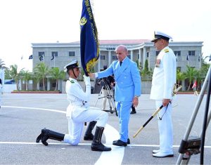 Prime Minister Muhammad Shehbaz Sharif handing over the flag to the high achieving company during the term at the passing out ceremony of 125th Midshipmen and 33rd SSC courses at Pakistan Naval Academy, PNS Rahbar