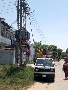 MEPCO electricians repair an electricity transmission tower to restore power supply and ensure uninterrupted electricity services in the city.