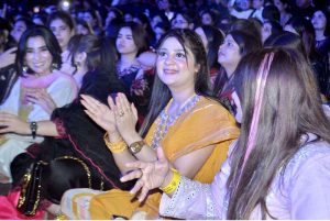 Women enjoy themselves while renowned singer Rahat Fateh Ali Khan performs songs and Qawwali during a night of music at a local hotel late Sunday night