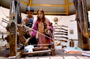 Visitor taking interest in display items at the Heritage Museum