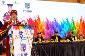 Chairman Senate of Pakistan Syed Yousaf Raza Gillani awards a distinction-holding graduate during the Annual Convocation 2026 of the College of Tourism and Hotel Management (COTHM) at a local hall.