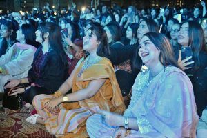 Women enjoy themselves while renowned singer Rahat Fateh Ali Khan performs songs and Qawwali during a night of music at a local hotel late Sunday night