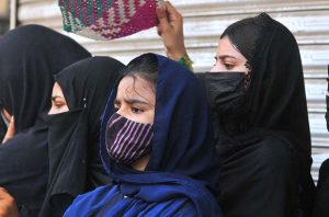 Women mourners attending the main Ashura procession on 10th of Holy Month of Muharram-ul-Harram at Ghanta Ghar Chowk. Muharram, the first month of the Islamic calendar, is observed as a month of mourning in remembrance of the martyrdom (Shahadat) of Hazrat Imam Hussain (RA), the grandson of the Holy Prophet Muhammad (PBUH)