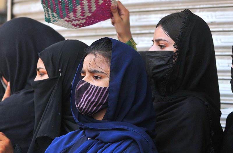 Women mourners attending the main Ashura procession on 10th of Holy Month of Muharram-ul-Harram at Ghanta Ghar Chowk. Muharram, the first month of the Islamic calendar, is observed as a month of mourning in remembrance of the martyrdom (Shahadat) of Hazrat Imam Hussain (RA), the grandson of the Holy Prophet Muhammad (PBUH)