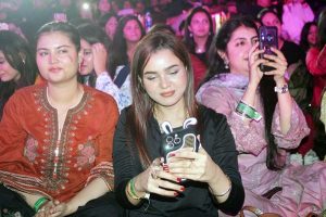 Women enjoy themselves while renowned singer Rahat Fateh Ali Khan performs songs and Qawwali during a night of music at a local hotel late Sunday night