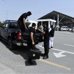 Police commandos and officials from Pakistan's Federal Board of Revenue (FBR) shifting physical boxes containing copies of the FY2026–27 federal budget into Parliament House in Islamabad