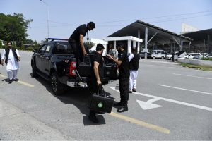Police commandos and officials from Pakistan's Federal Board of Revenue (FBR) shifting physical boxes containing copies of the FY2026–27 federal budget into Parliament House in Islamabad