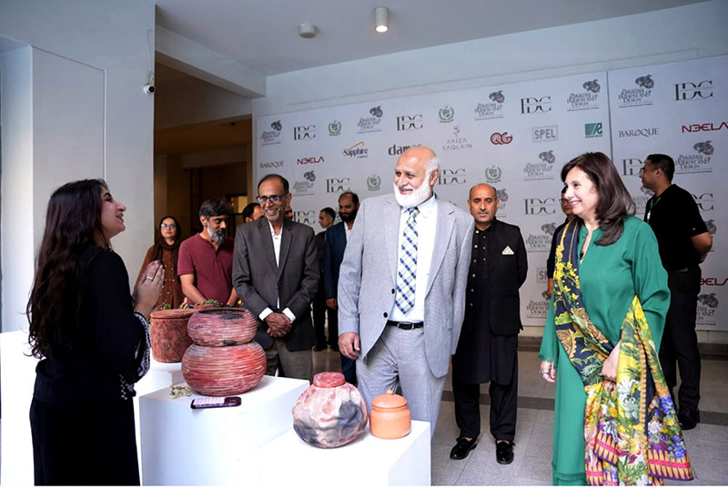 Prof. Dr. Niaz Ahmad Akhtar (S.I.), Chairman of the Higher Education Commission (HEC) visit stalls with Vice Chancellor Prof. Hina Tayyaba Khalil during the Thesis Display 2026 at Pakistan Institute of Fashion and Design (PIFD)