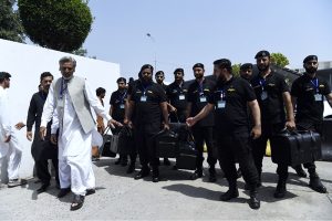 Police commandos and officials from Pakistan's Federal Board of Revenue (FBR) shifting physical boxes containing copies of the FY2026–27 federal budget into Parliament House in Islamabad