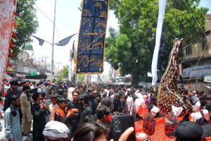 Volunteers distributing food packets and water among the mourners participates in the 9th Muharram-ul-Haram procession at Mumtazabad area. Muharramul Haram is known as the first month of the Islamic calendar and the mourning month in remembrance of the martyrdom (Shahadat) of Hazrat Imam Hussain (RA), the grandson of the Holy Prophet Mohammad (PBUH)